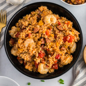 shrimp and sausage jambalaya in a black bowl