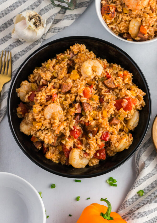 shrimp and sausage jambalaya in a black bowl