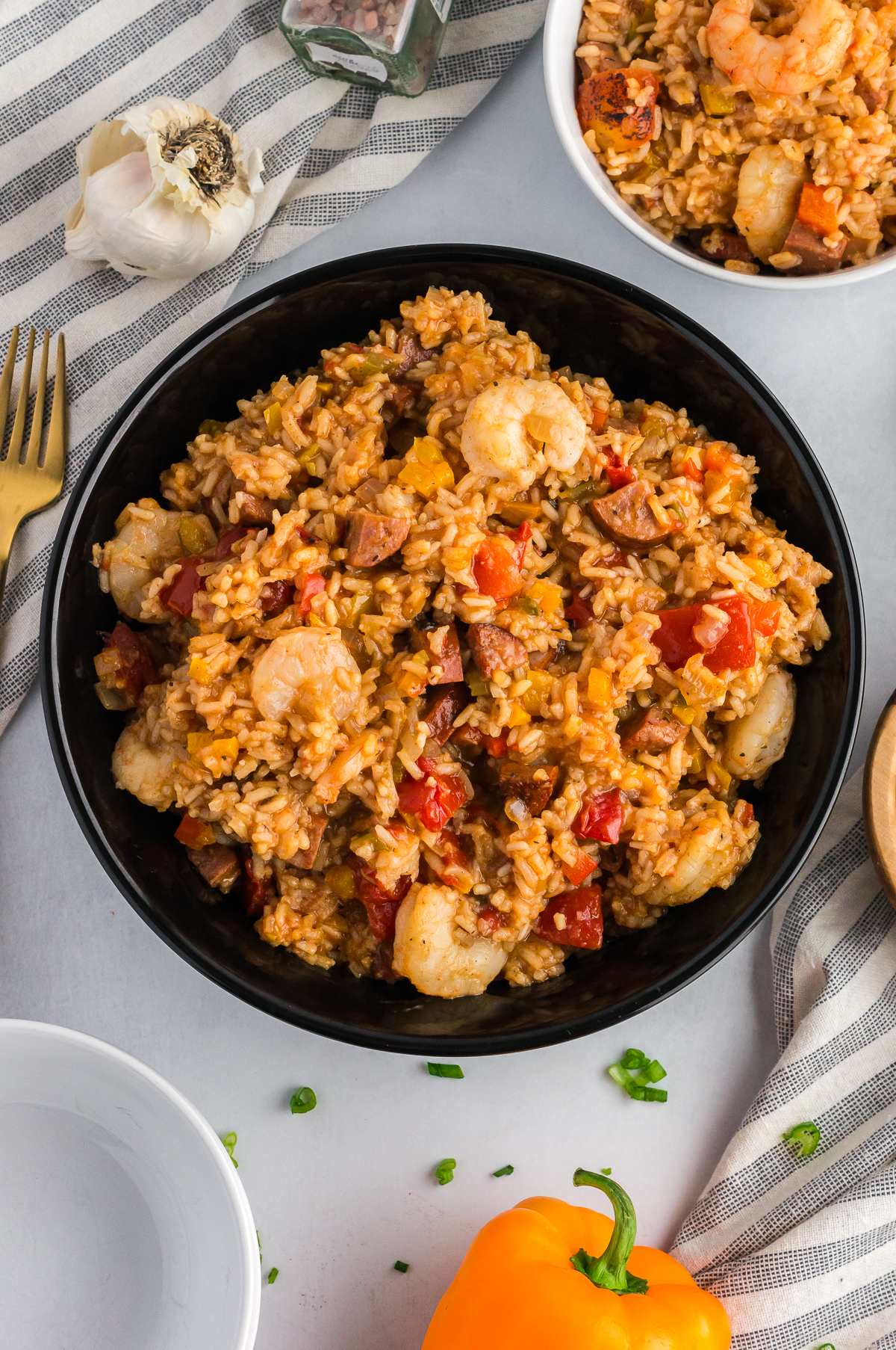 shrimp and sausage jambalaya in a black bowl
