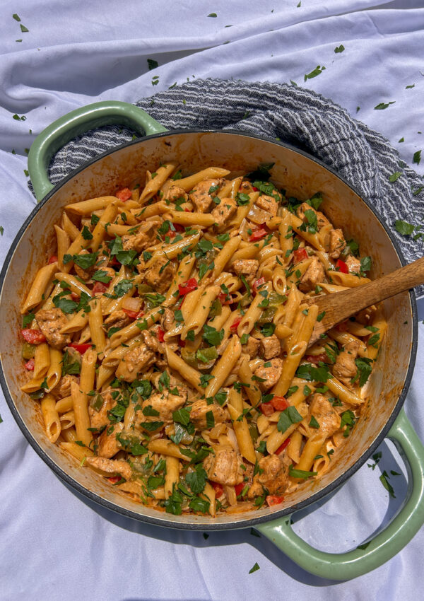 Creamy Cajun chicken pasta with penne pasta, bell peppers, and Parmesan cream sauce