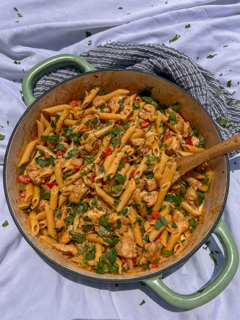 Creamy Cajun chicken pasta with penne pasta, bell peppers, and Parmesan cream sauce