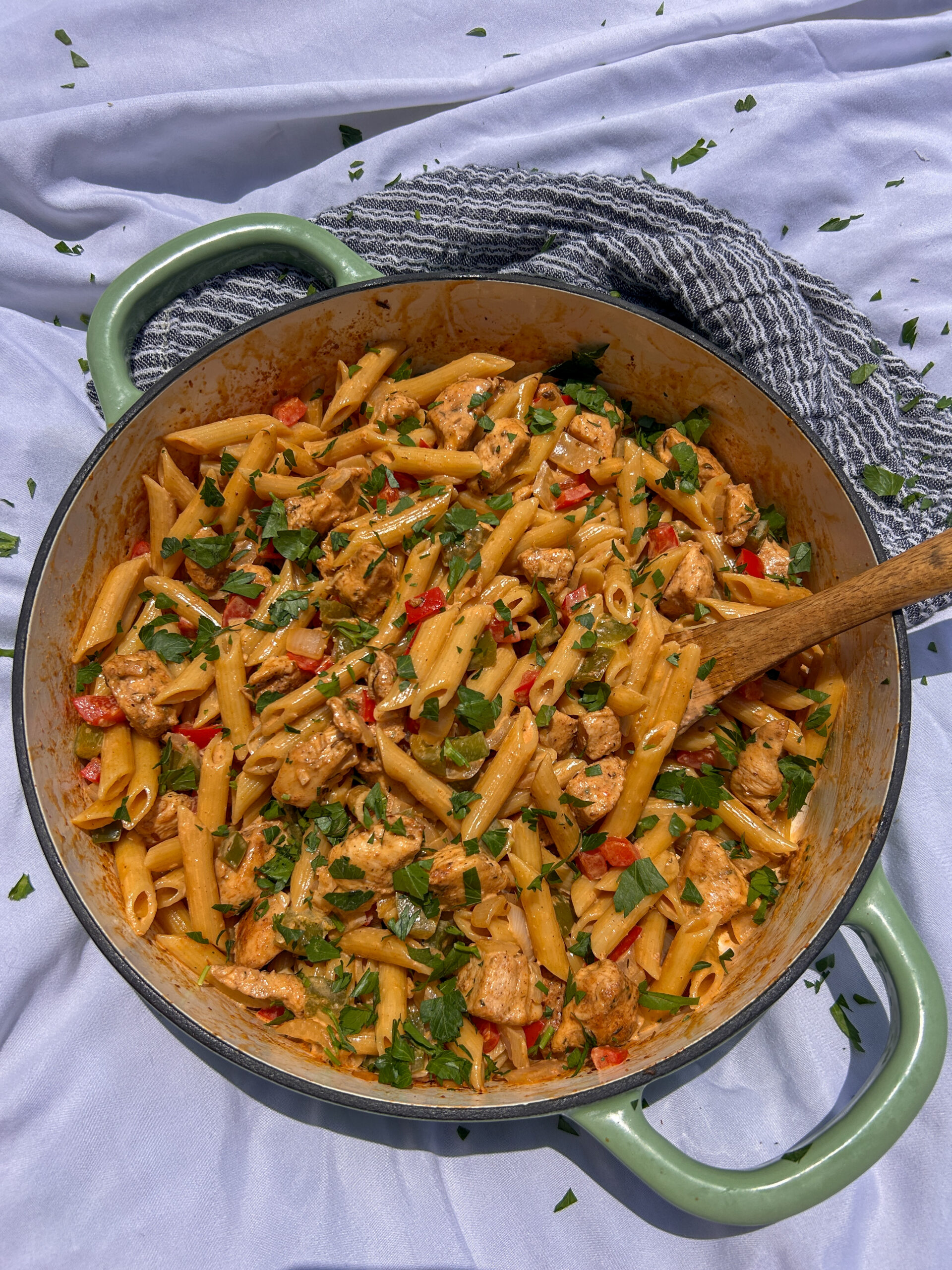 Creamy Cajun chicken pasta with penne pasta, bell peppers, and Parmesan cream sauce
