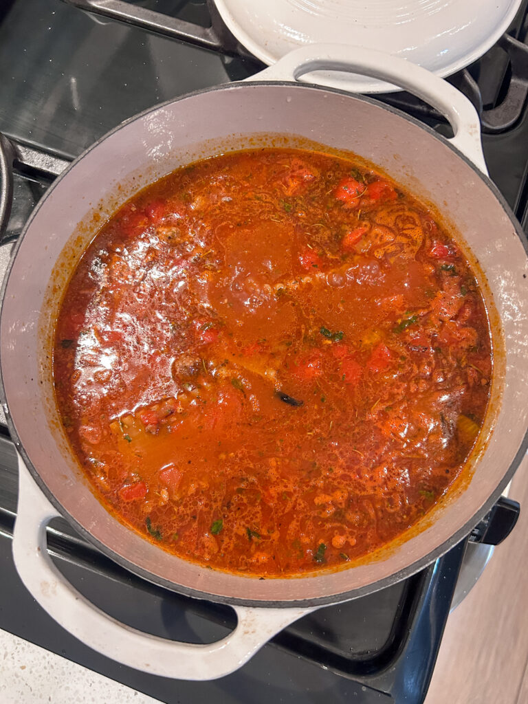 Lasagna soup simmering with tender noodles