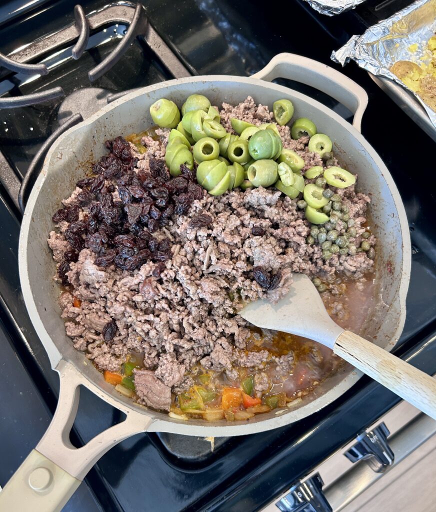 Adding olives raisins and capers to Cuban picadillo