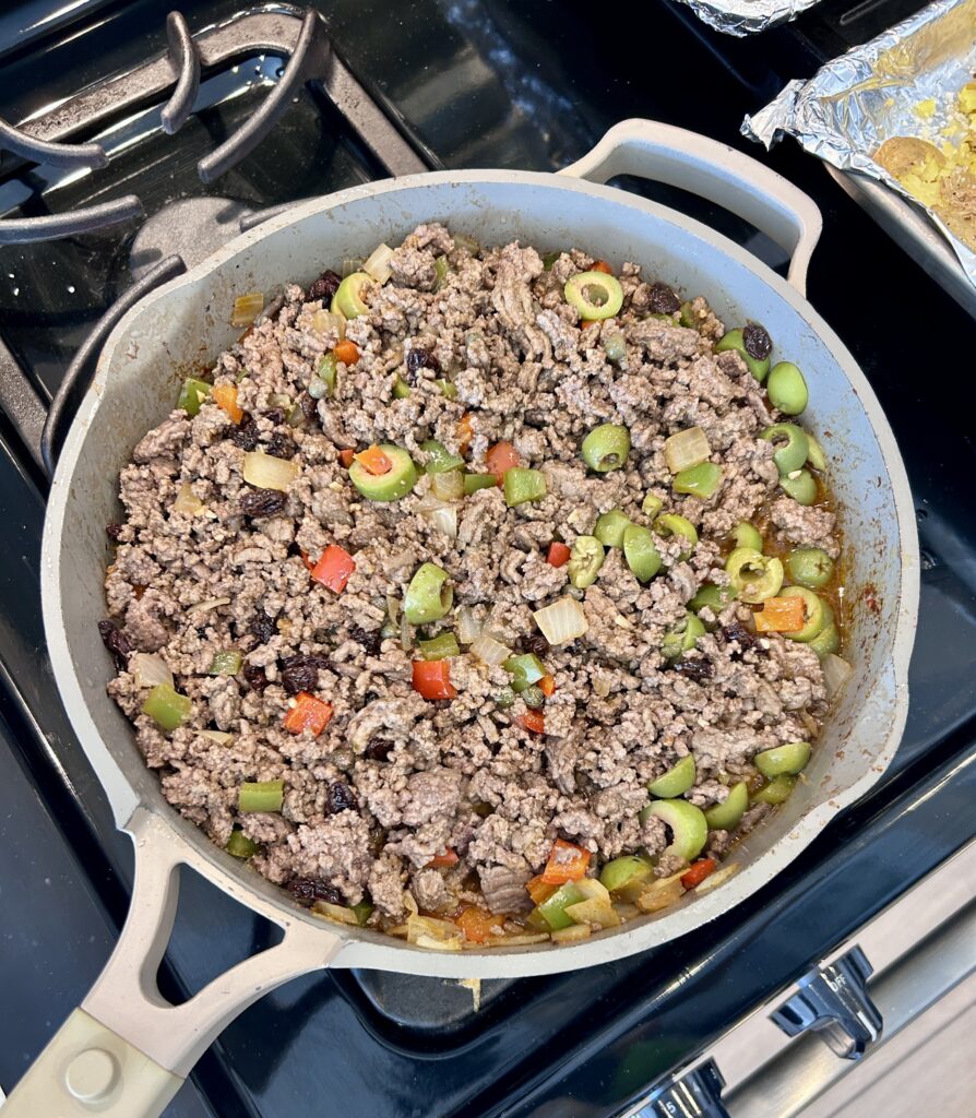 Cuban picadillo simmering until thick