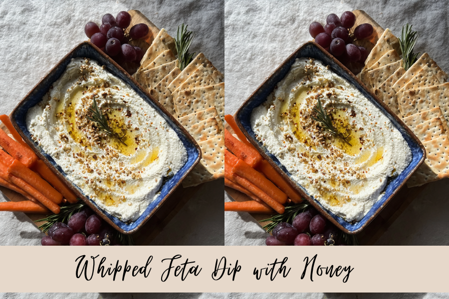 whipped feta served with crackers and vegetables on an appetizer board