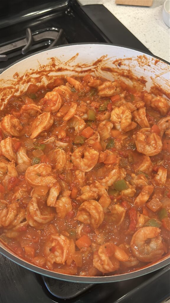 Shrimp cooking in rich Cuban tomato sauce for camarones enchilados