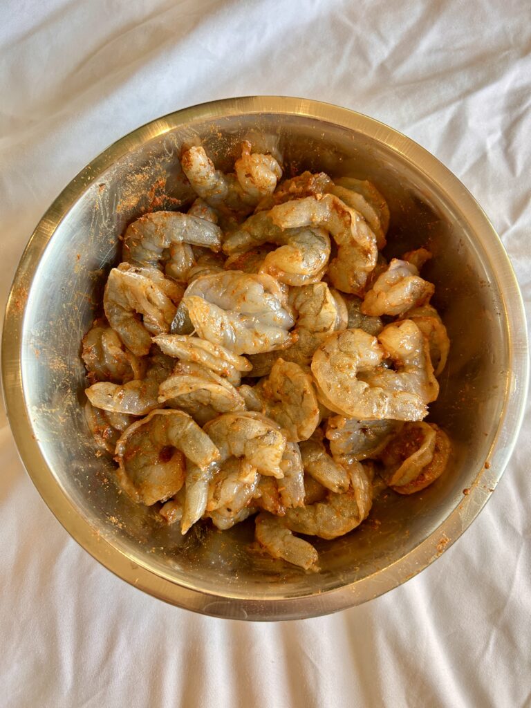 Large shrimp seasoned with Cuban seasoning before cooking camarones enchilados