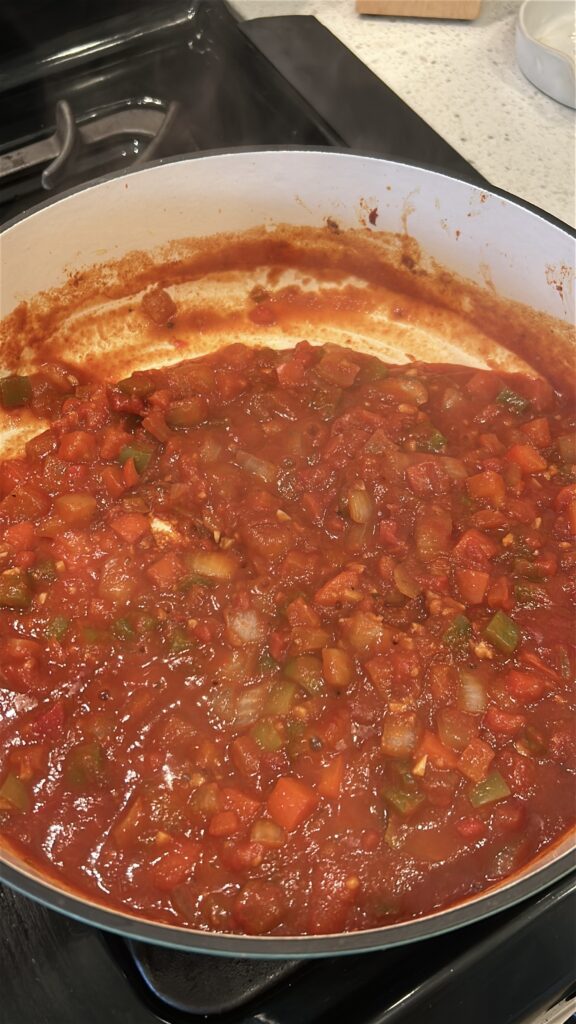 Rich tomato-based Cuban Creole sauce simmering for camarones enchilados