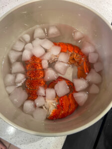 cooked lobster tails in ice bath