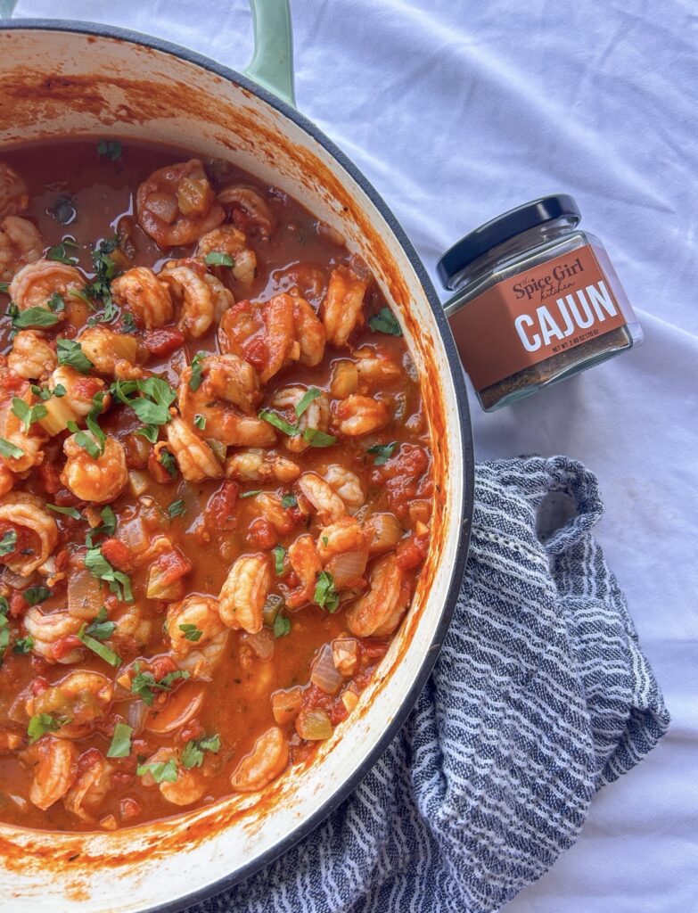 Garnishing Shrimp Creole with parsley and/or green onions