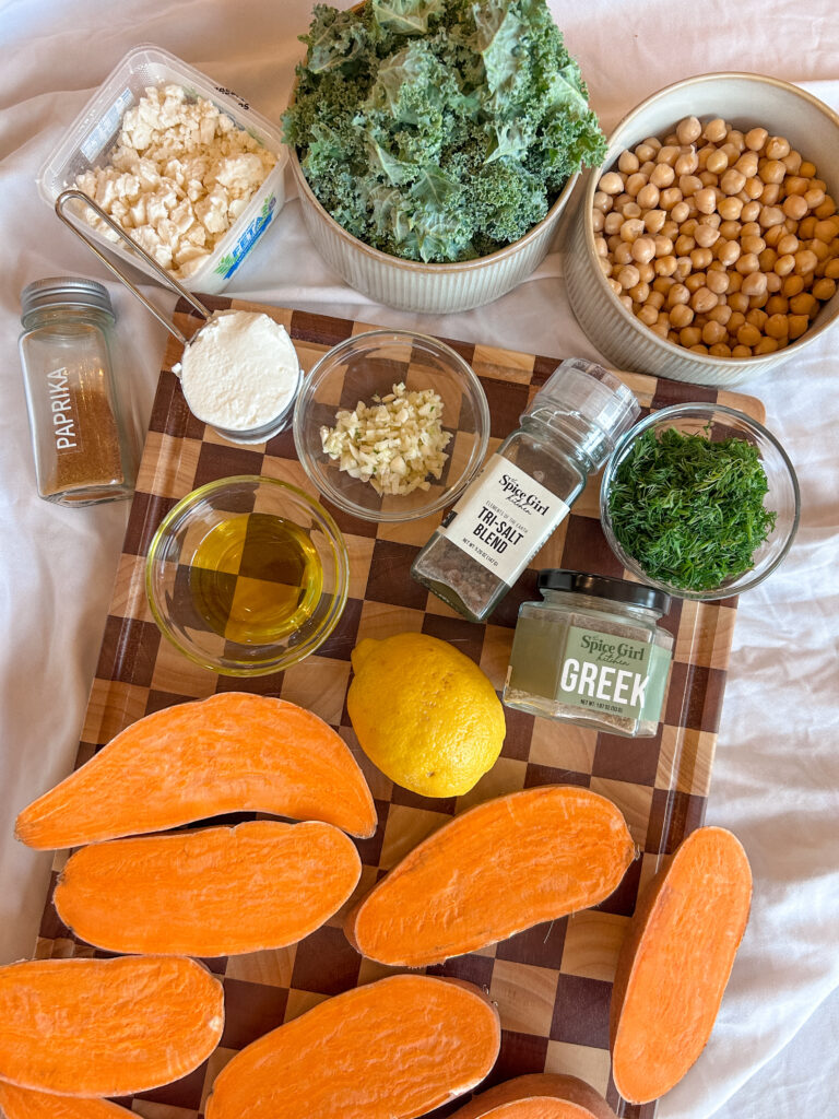 ingredients for greek sweet potato boats including sweet potatoes feta chickpeas and kale