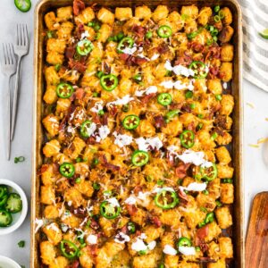 sheet pan tater tot nachos on a white countertop