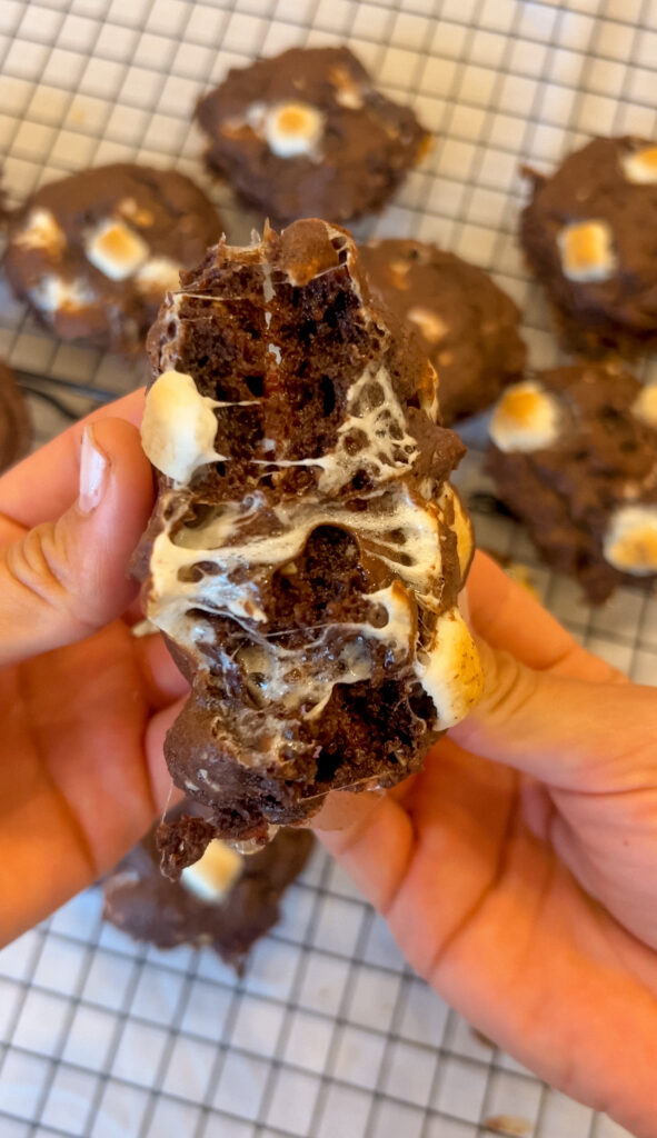 Inside view of rocky road cookie showing melted chocolate and marshmallow