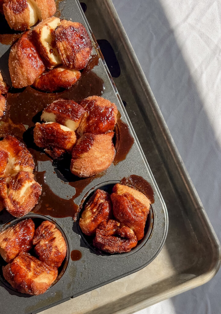 freshly baked mini monkey breads with caramel edges in muffin pan