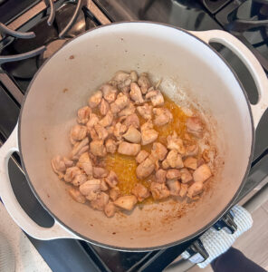 browning chicken in dutch oven for authentic cajun pastalaya