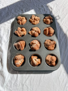 unbaked mini monkey bread bites in muffin pan before baking