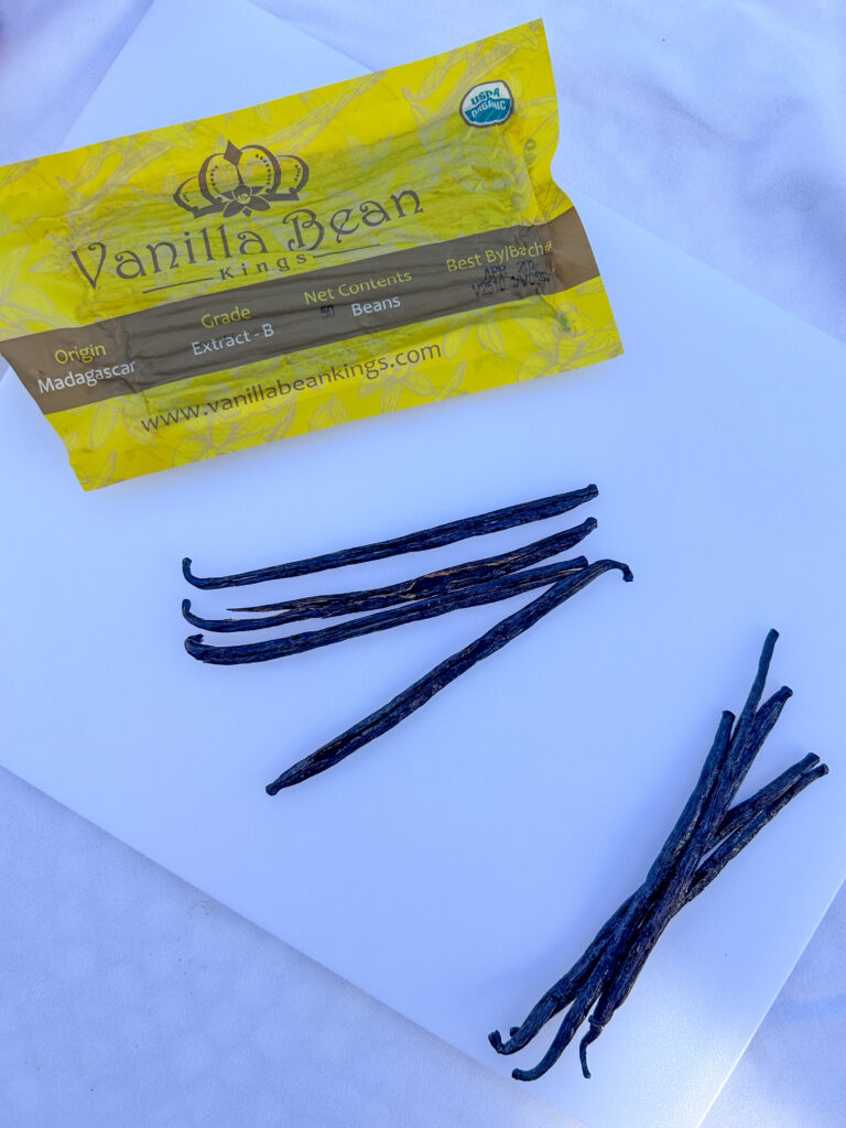 splitting vanilla beans to make whiskey vanilla extract