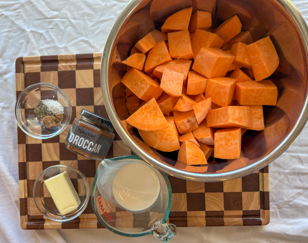 ingredients for instant pot mashed sweet potatoes including sweet potatoes butter and cream