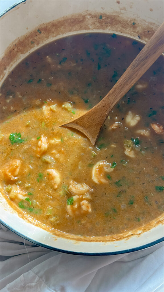 Finished shrimp etouffee in a pot showing thick, silky gravy