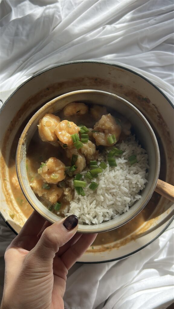 Serving shrimp etouffee over white rice