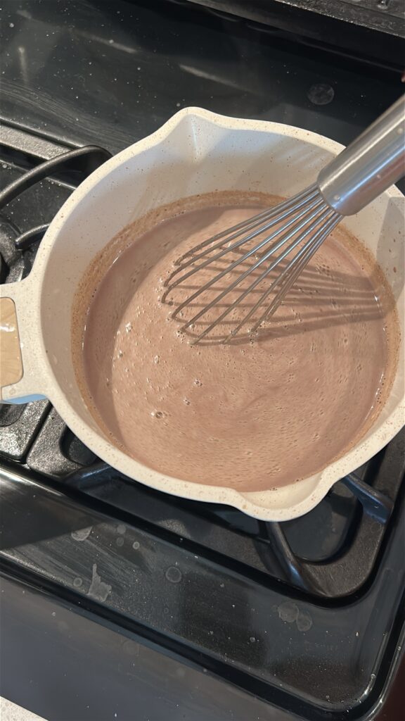 whisking peppermint hot chocolate until smooth and glossy