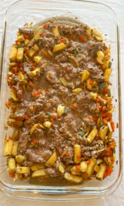 Cooked meat and vegetables for breakfast burrito filling