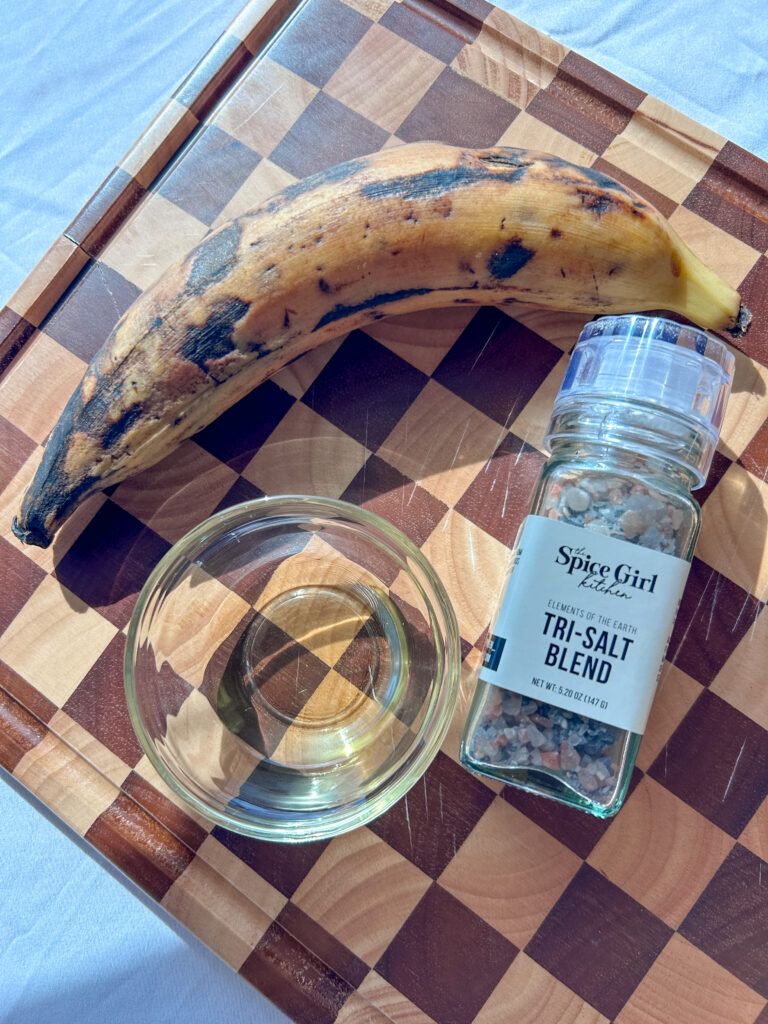 Ingredients for fried sweet plantains including ripe plantains and oil