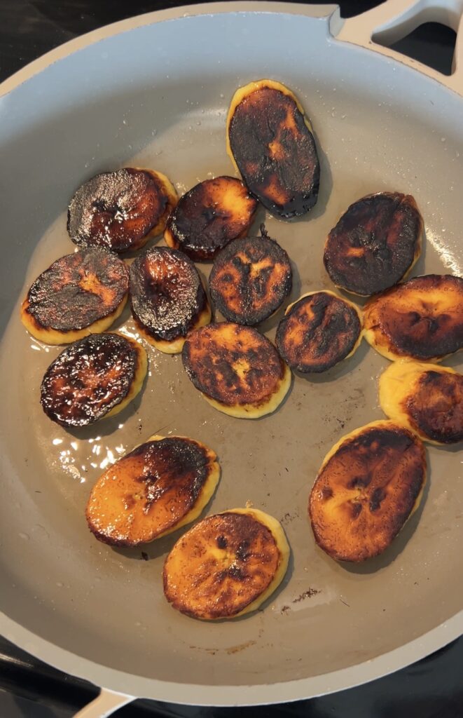 Frying sweet plantains on the second side until caramelized