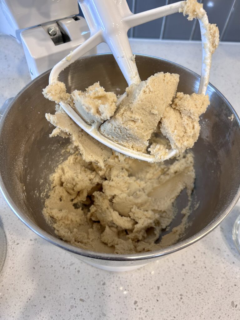 adding dry ingredients to cookie dough