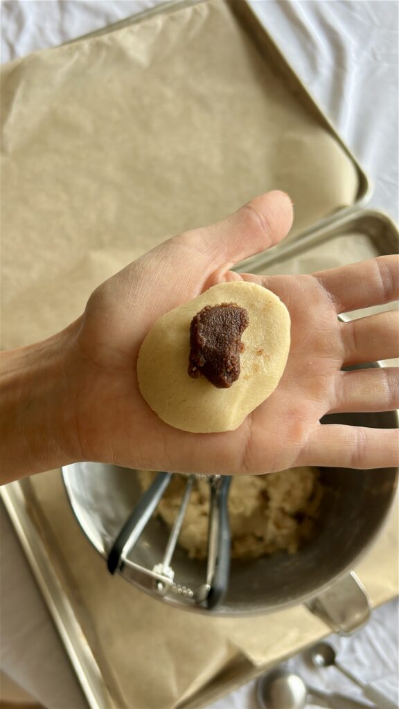 adding cinnamon filling to cookie dough