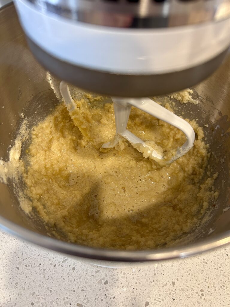 adding wet ingredients to cookie dough