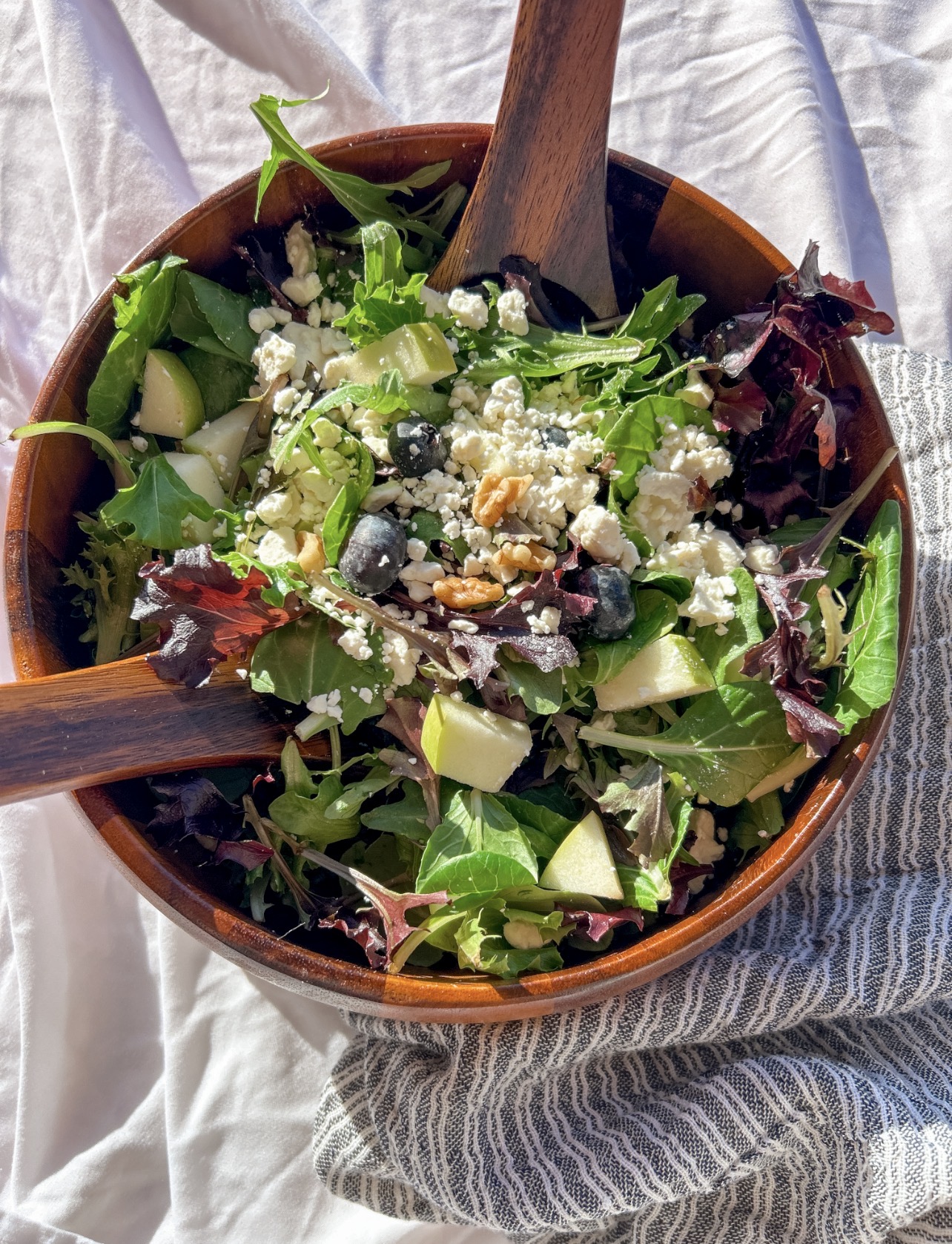 close up hero of blueberry apple salad with feta and walnuts