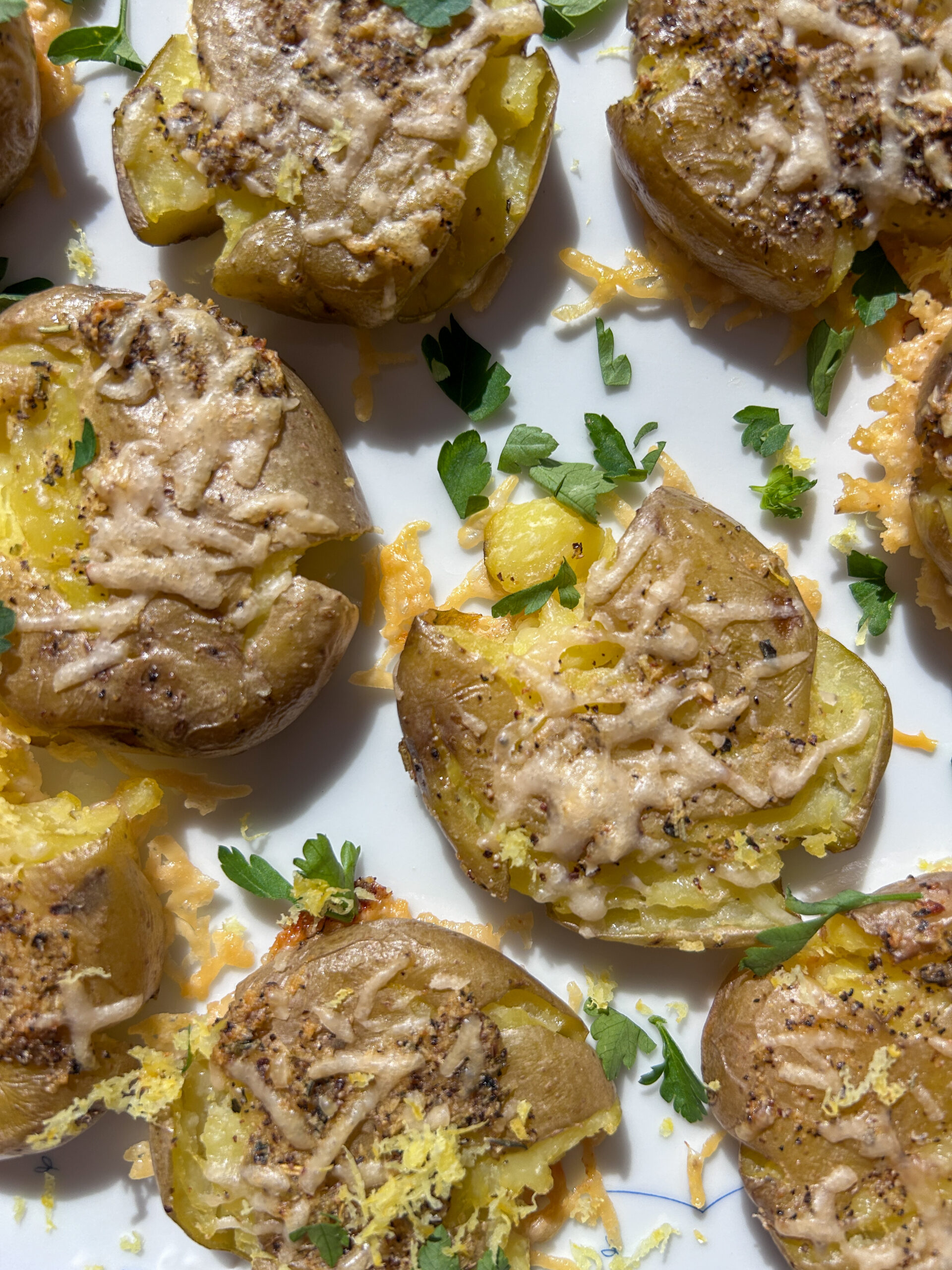 close up of ultra crispy parmesan smashed potatoes with fluffy center