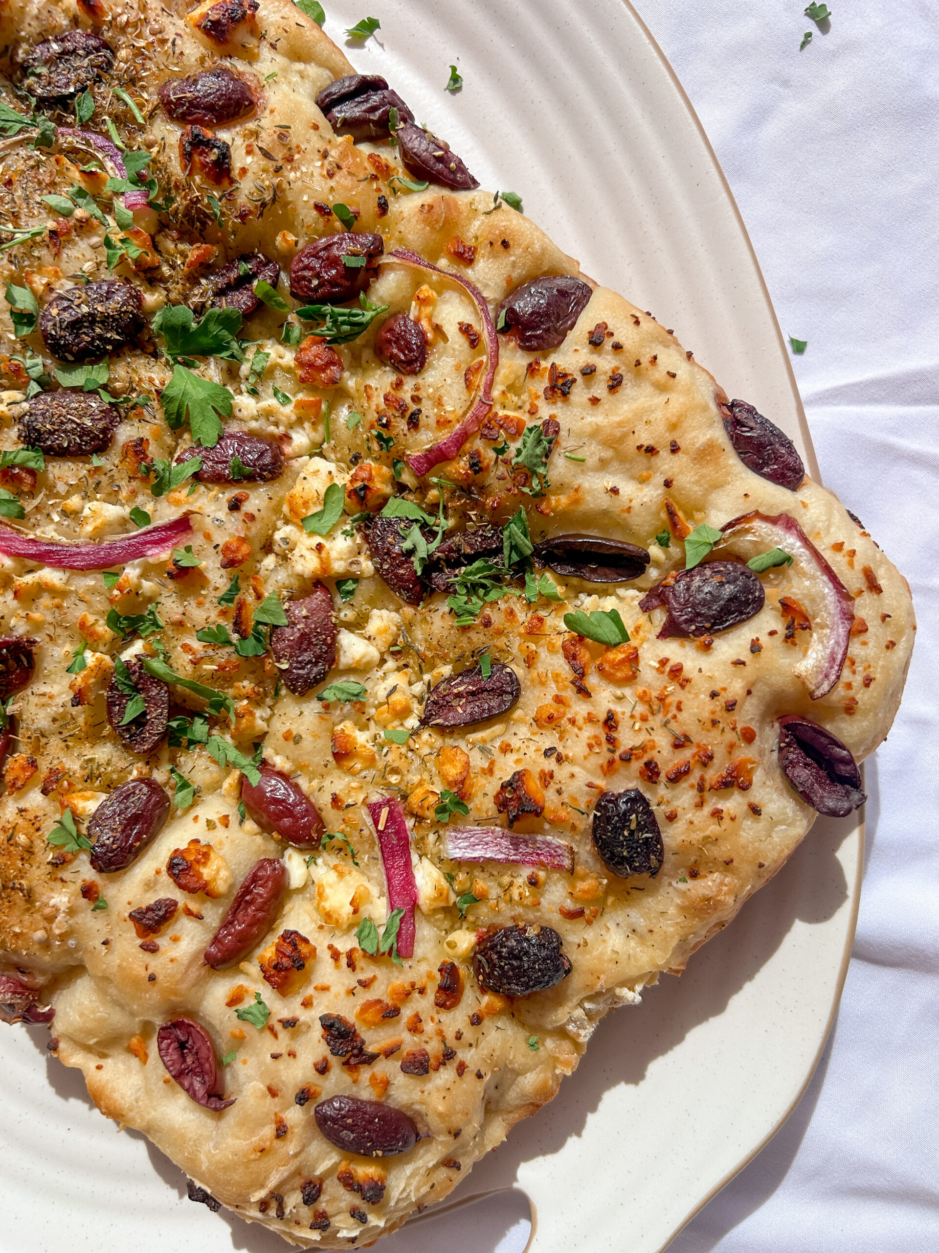 Greek focaccia with crispy olive oil crust