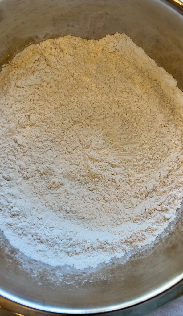 Mixing dry ingredients for greek yogurt bagels
