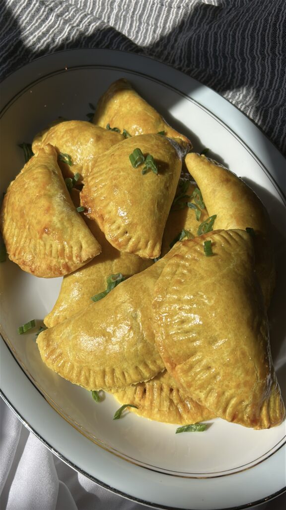 Freshly baked Jamaican meat pies with golden flaky crust