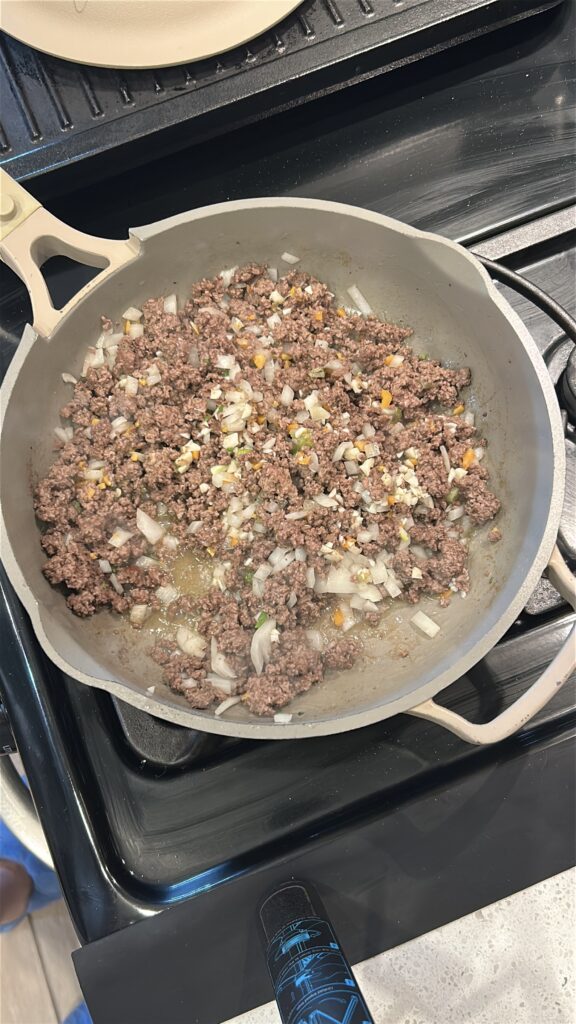 Browning ground beef and onion for Jamaican meat pie filling