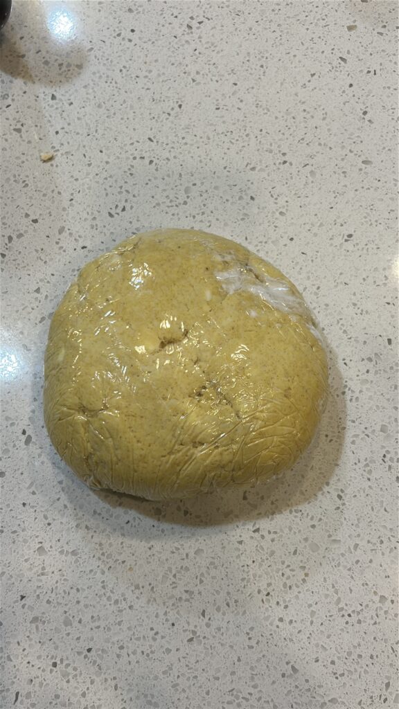 Jamaican meat pie dough wrapped and chilling before rolling