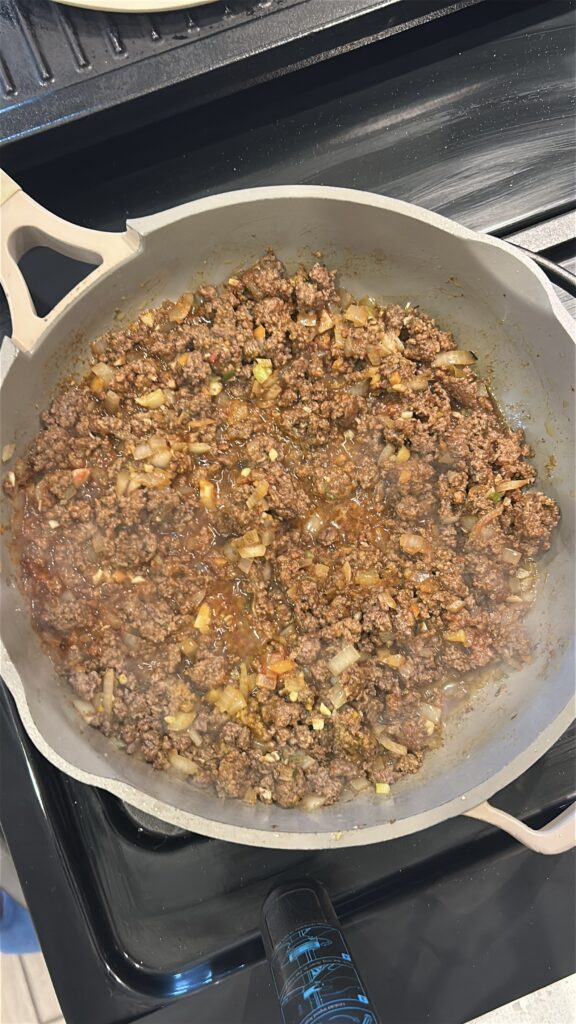 Spiced beef filling simmering for Jamaican meat pie recipe