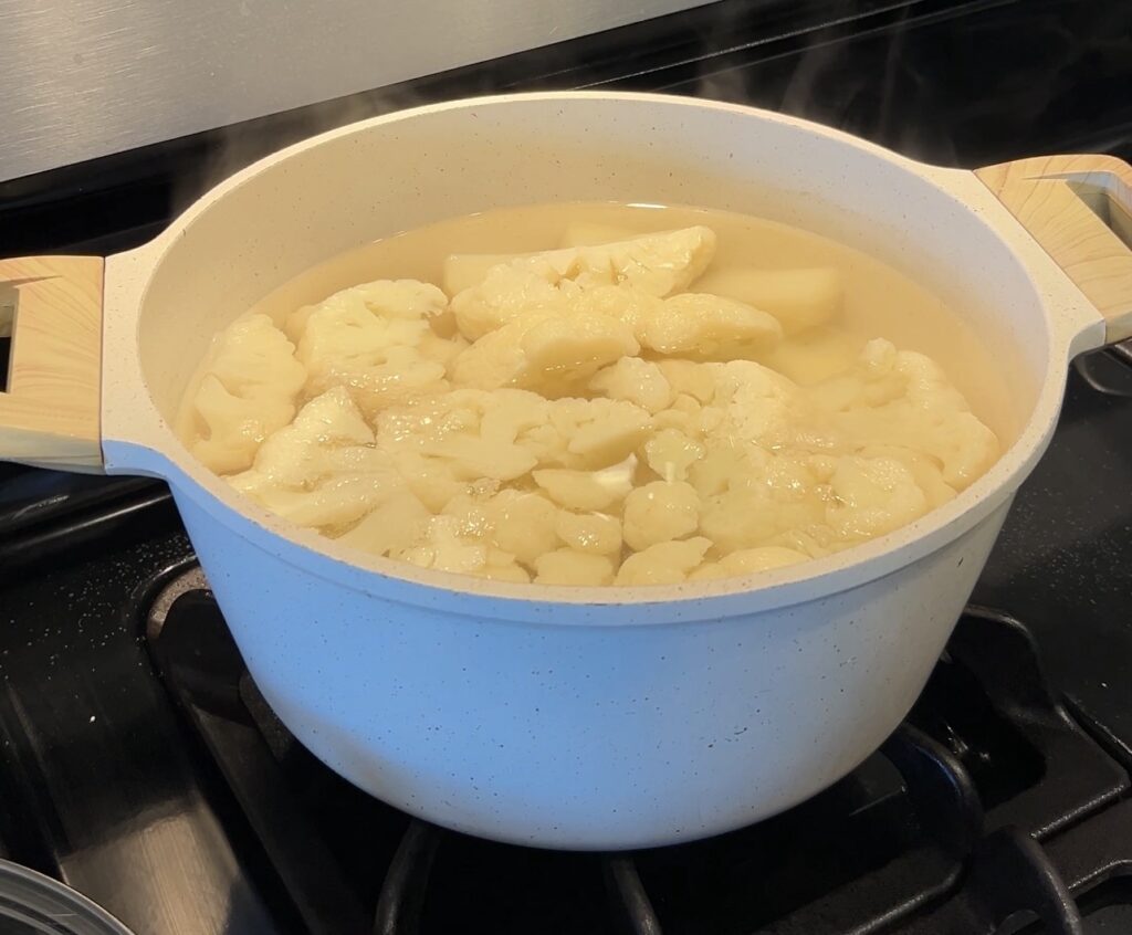 Potatoes and cauliflower boiling for shepherd’s pie mash topping