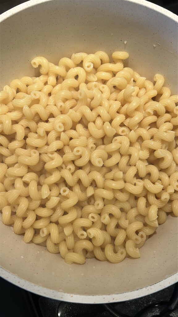 cooking cellentani pasta for taco mac and cheese