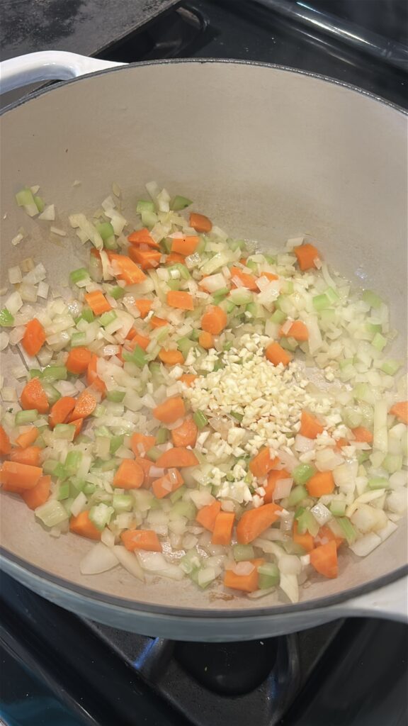 cooking onion carrots and celery for italian wedding soup base
