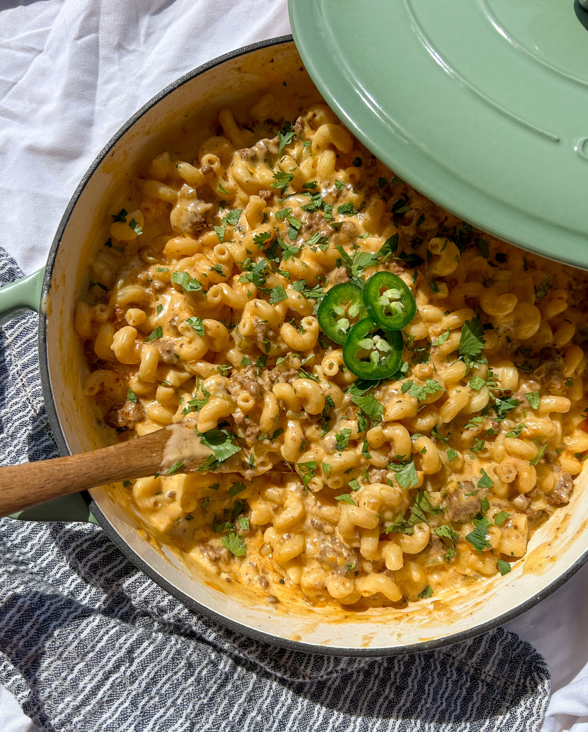 creamy taco mac and cheese with cellentani pasta, seasoned beef, and melted cheese