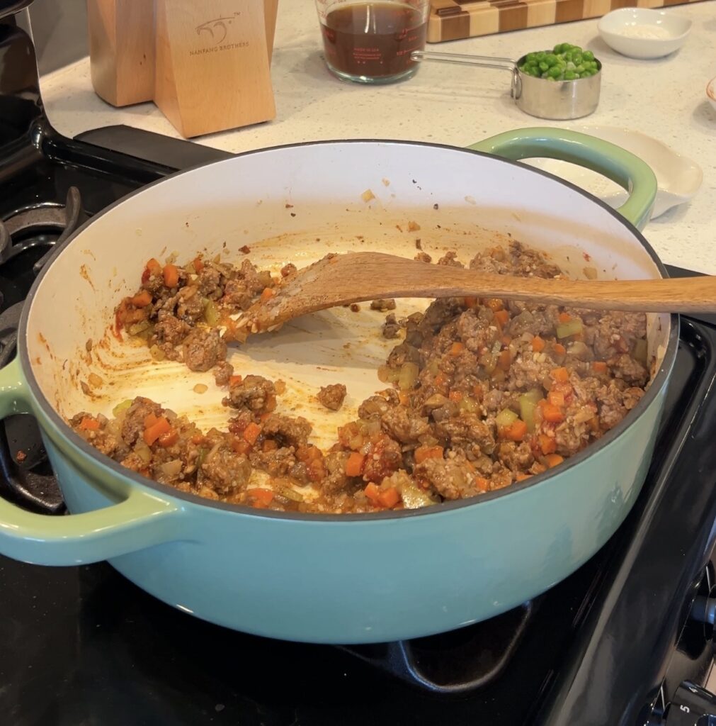 Browning ground lamb with shepherd’s pie seasoning and garlic