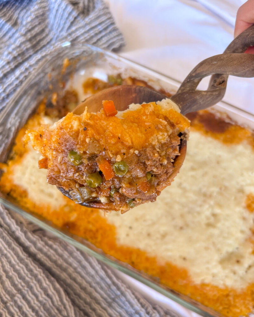 Close-up of shepherd’s pie showing layers of lamb filling and creamy mash