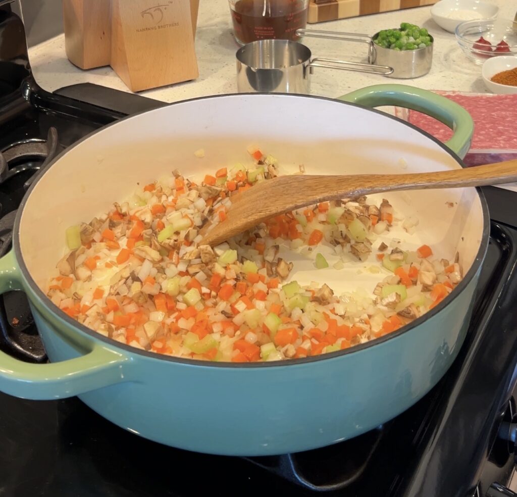 Cooking vegetables for shepherd’s pie filling with onions, carrots, and celery