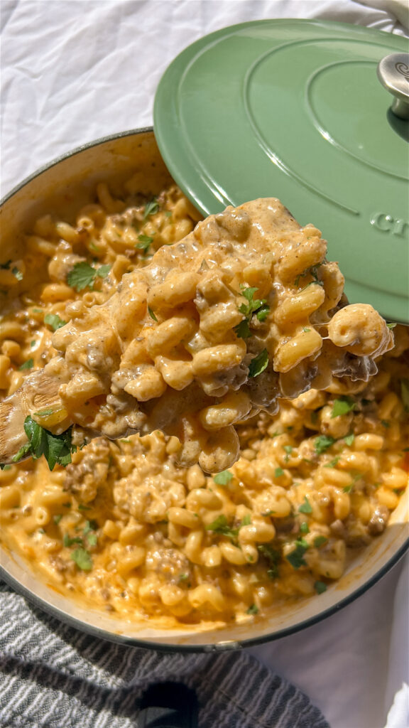 close up of creamy taco mac and cheese with melted cheese and pasta