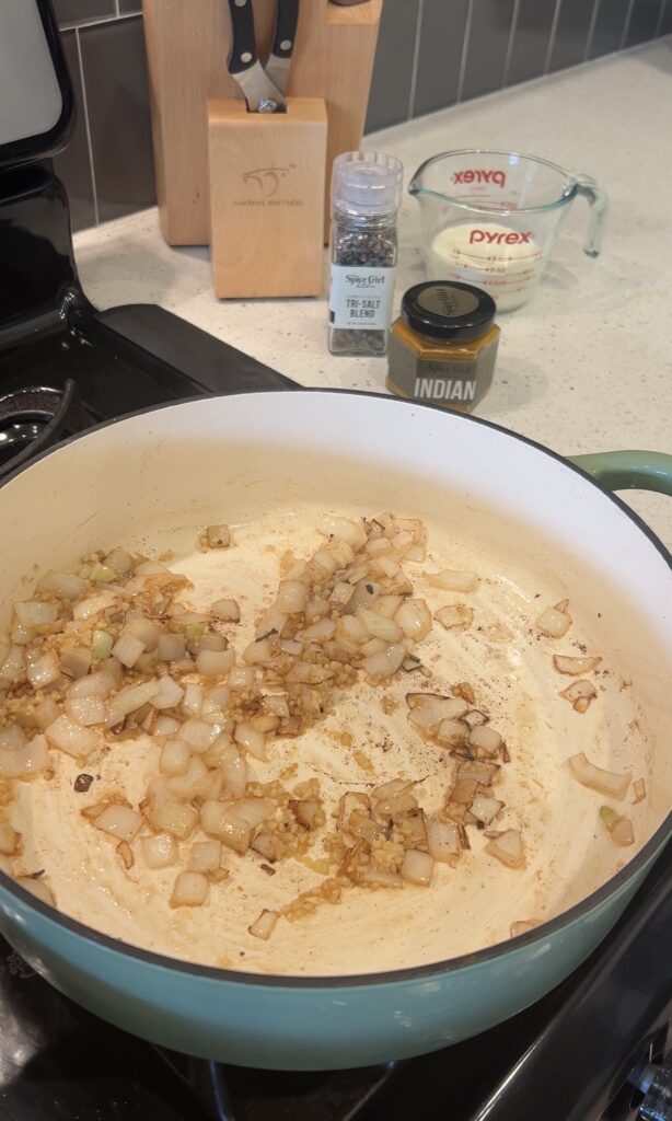Cooking onion, garlic, and ginger for chicken tikka masala base