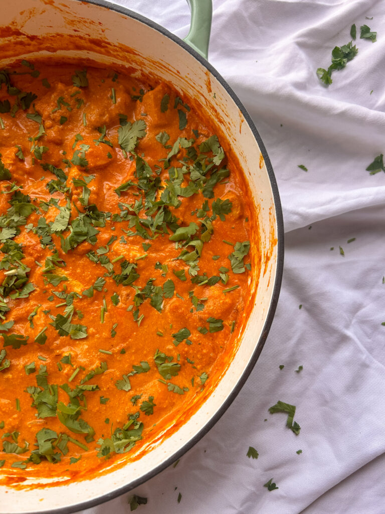 Close up of creamy chicken tikka masala sauce with tender chicken